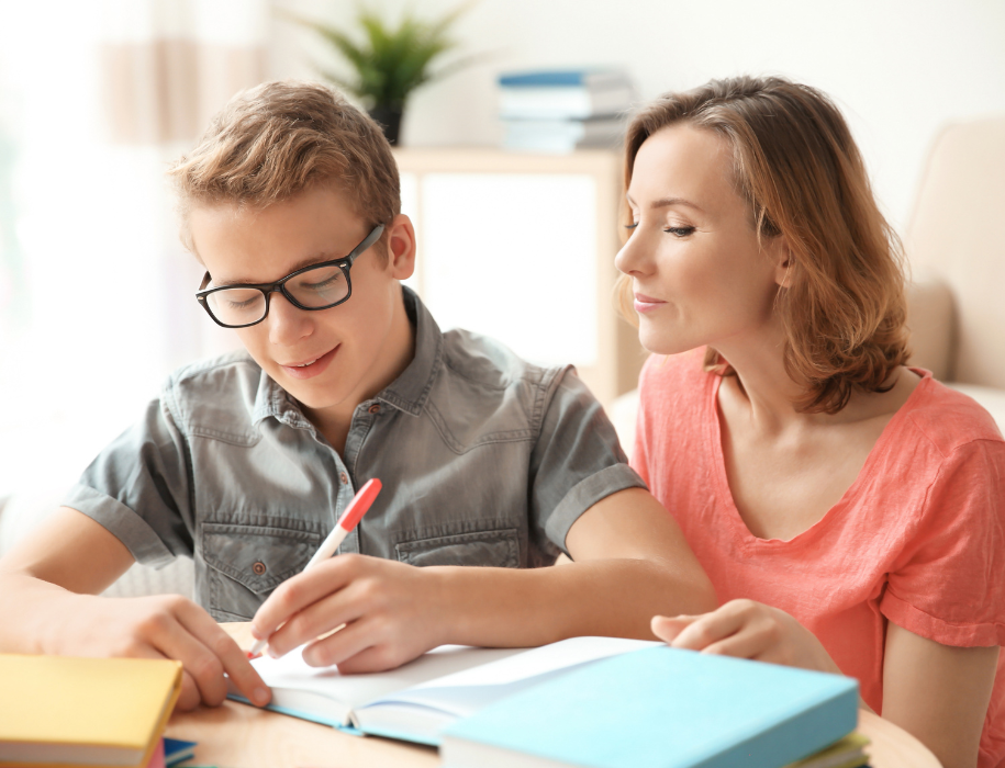 A person helping a child with homework